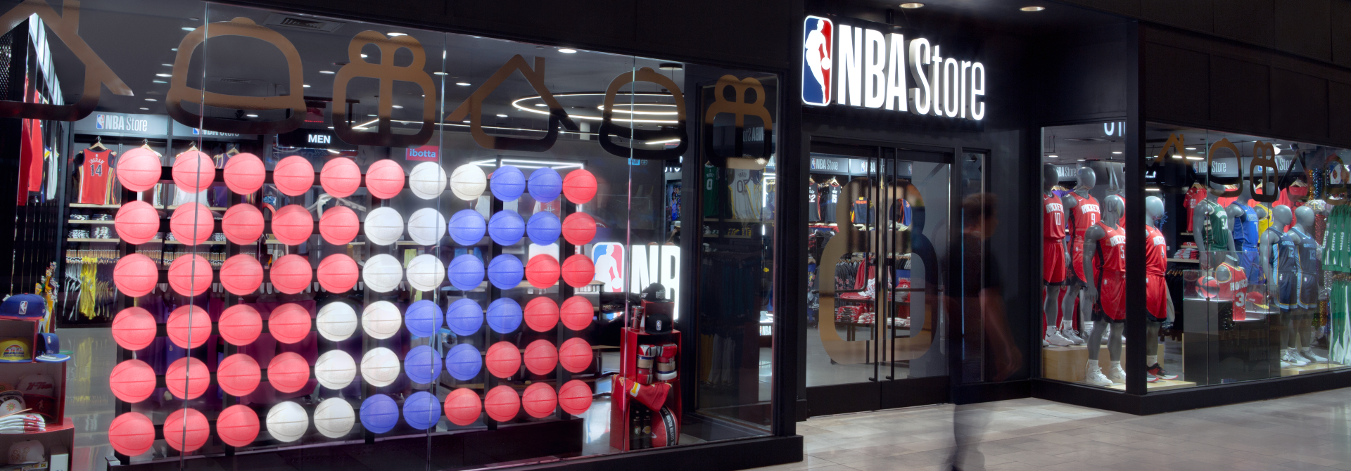 A shot of the Houston NBA store, including the LED Basketball wall in the front window.